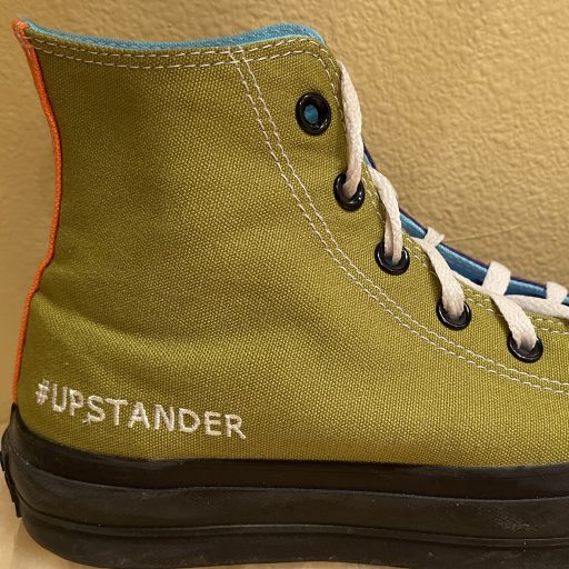 Chuck Taylor high top with #Upstander on the side
